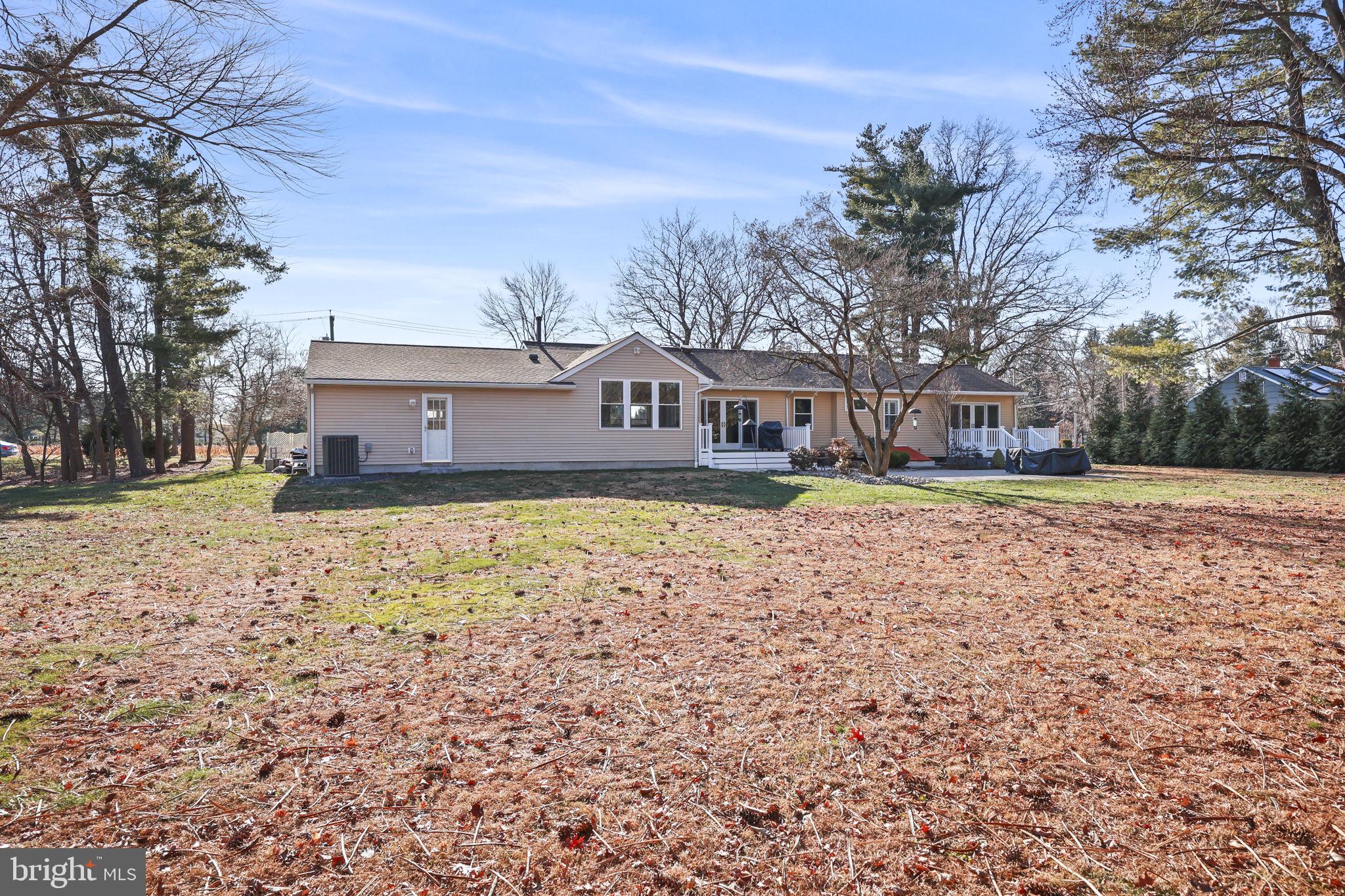 568 Village Road East Princeton Junction, NJ 08550 - Photo 39 of 43 a front view of a house with a yard