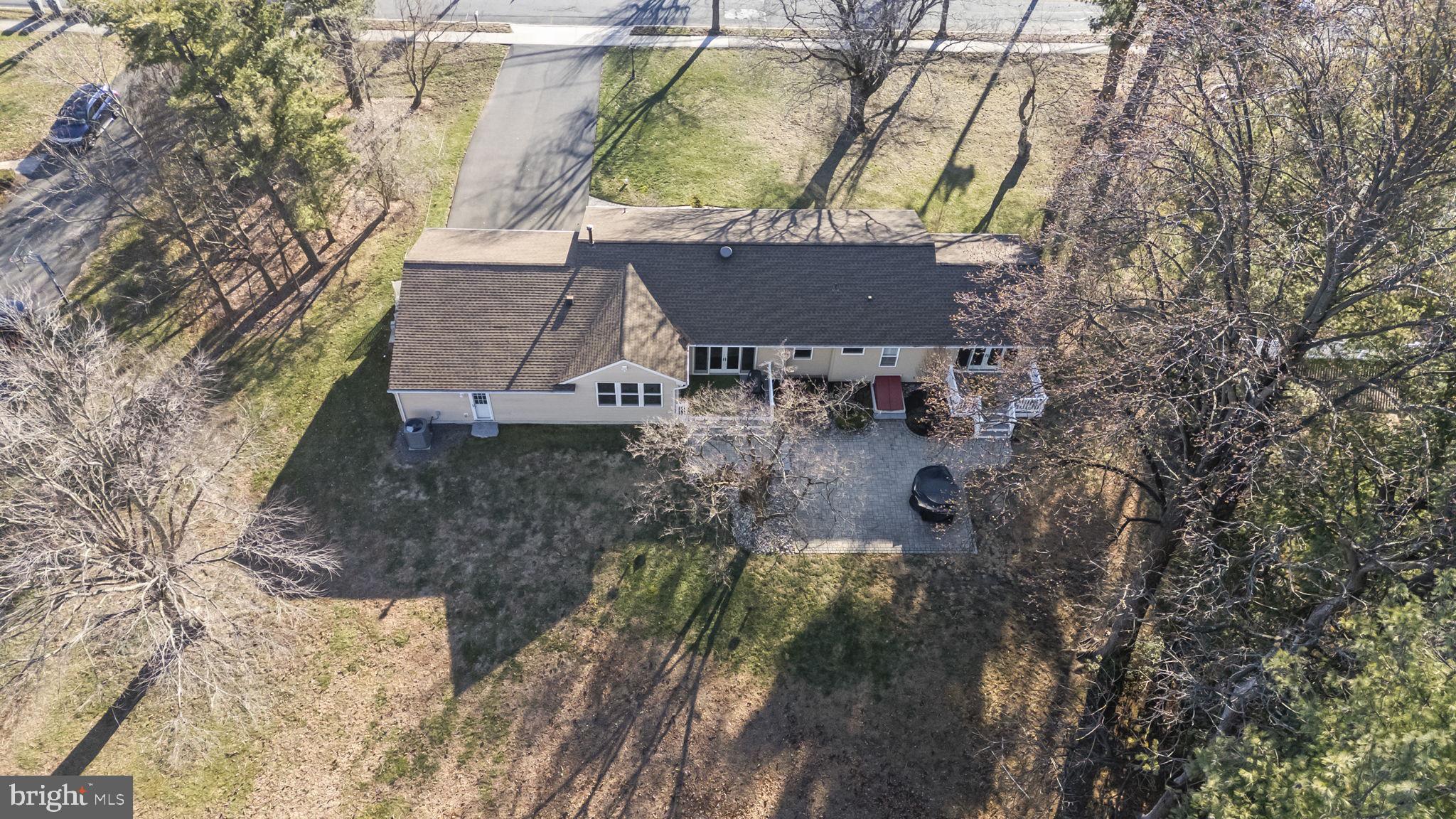 568 Village Road East Princeton Junction, NJ 08550 - Photo 41 of 43 a view of a house with a yard