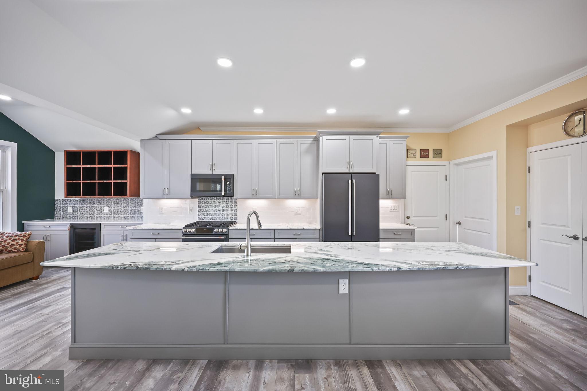568 Village Road East Princeton Junction, NJ 08550 - Photo 6 of 43 a view of kitchen with wooden floor