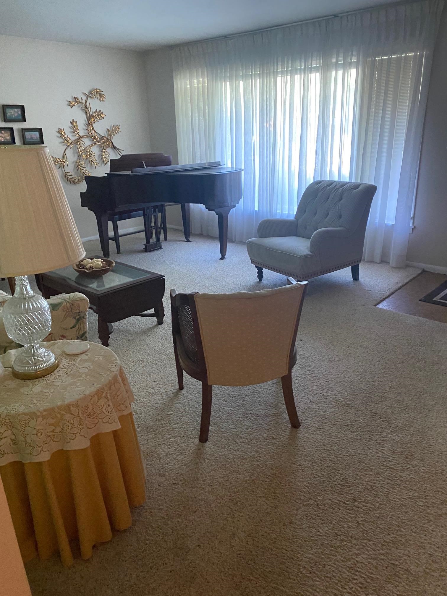 4619 Highcrest Road Rockford, IL 61107 - Photo 2 of 9 a living room with furniture and a window