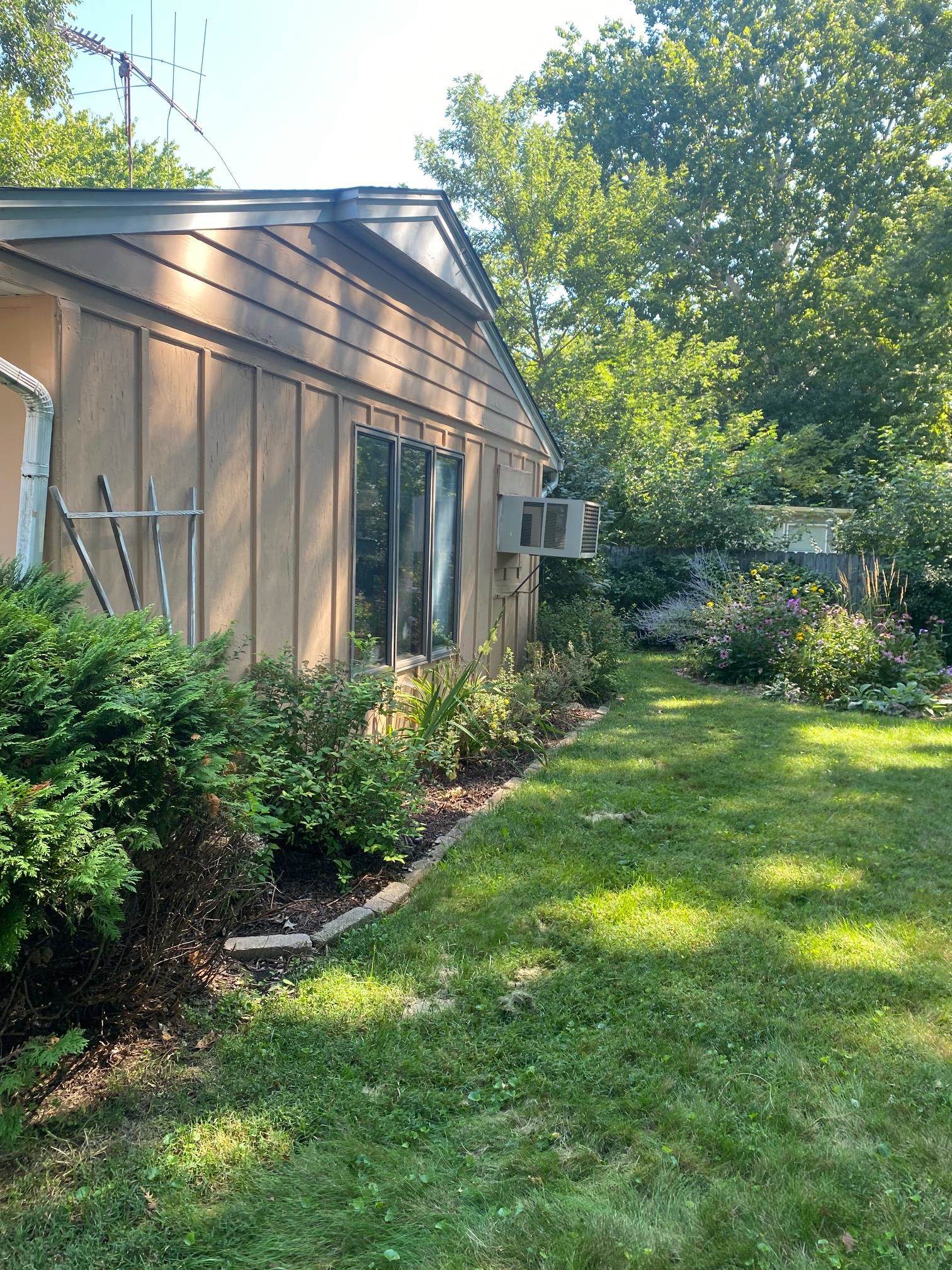 4619 Highcrest Road Rockford, IL 61107 - Photo 9 of 9 a view of backyard with potted plants and large tree