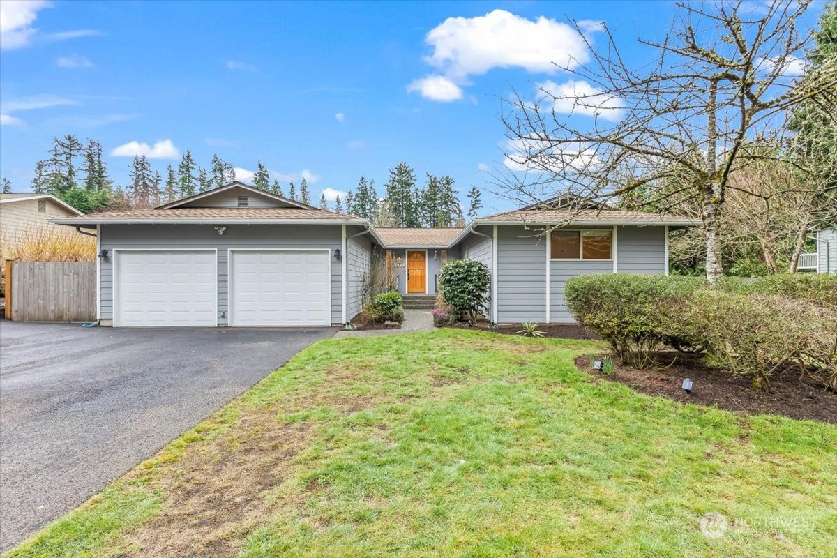 3218 199th Place Southeast Bothell, WA 98012 - Photo 1 of 33 a view of a house with a yard and potted plants