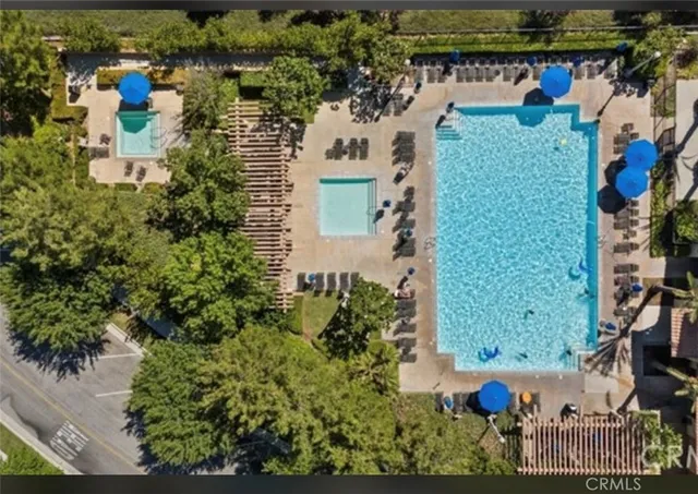 an aerial view of a house with a yard and garden