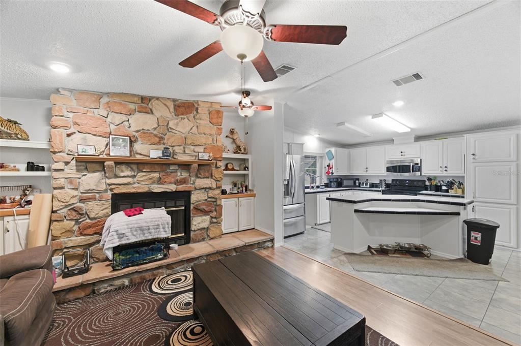 9634 Pat Street Hudson, FL 34669 - Photo 16 of 73 a kitchen with stainless steel appliances granite countertop a stove and cabinets