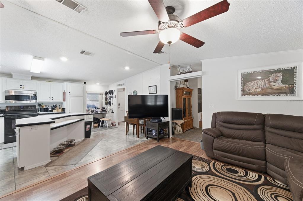 9634 Pat Street Hudson, FL 34669 - Photo 17 of 73 a living room with furniture and kitchen view