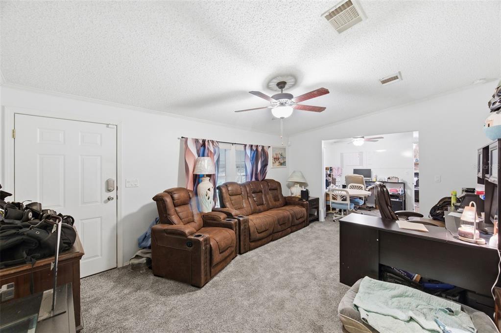 9634 Pat Street Hudson, FL 34669 - Photo 20 of 73 a living room with furniture and a window