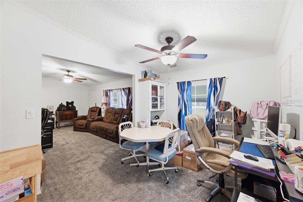 9634 Pat Street Hudson, FL 34669 - Photo 24 of 73 a view of a livingroom with furniture and a work space