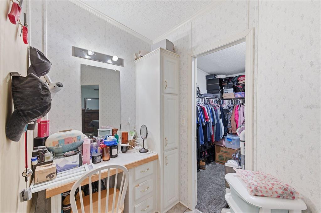 9634 Pat Street Hudson, FL 34669 - Photo 33 of 73 a view of walk in closet with clothes and shoes