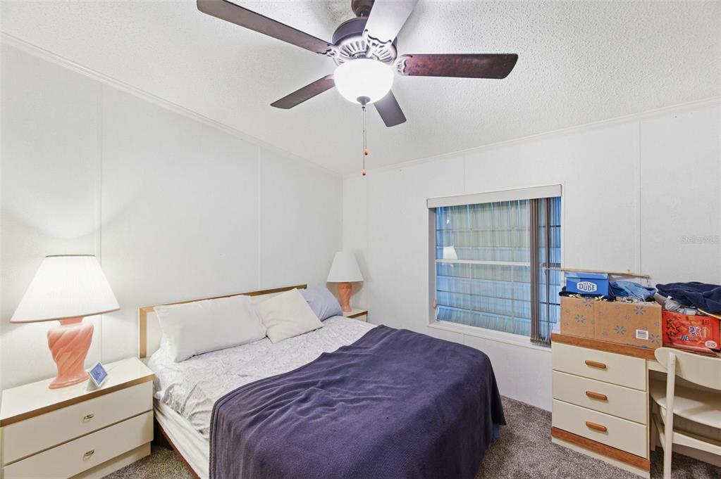 9634 Pat Street Hudson, FL 34669 - Photo 37 of 73 a bedroom with a bed and a dresser