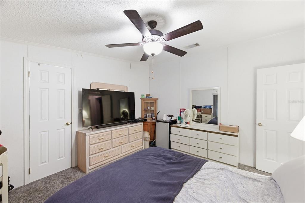 9634 Pat Street Hudson, FL 34669 - Photo 40 of 73 a living room with furniture and a flat screen tv