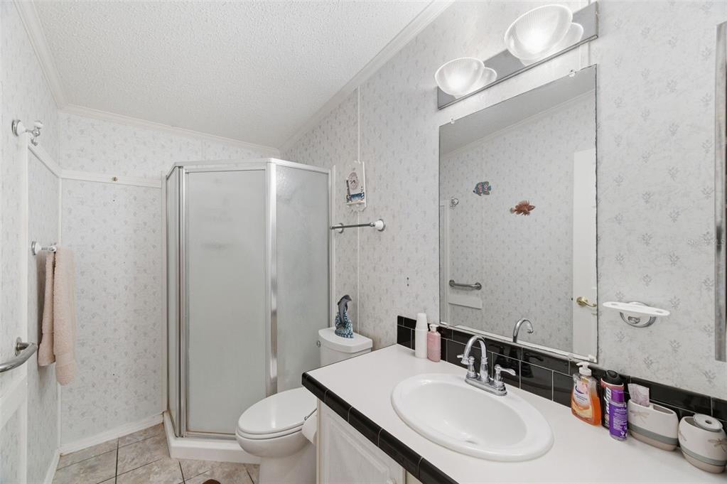 9634 Pat Street Hudson, FL 34669 - Photo 44 of 73 a bathroom with a sink toilet tub and shower