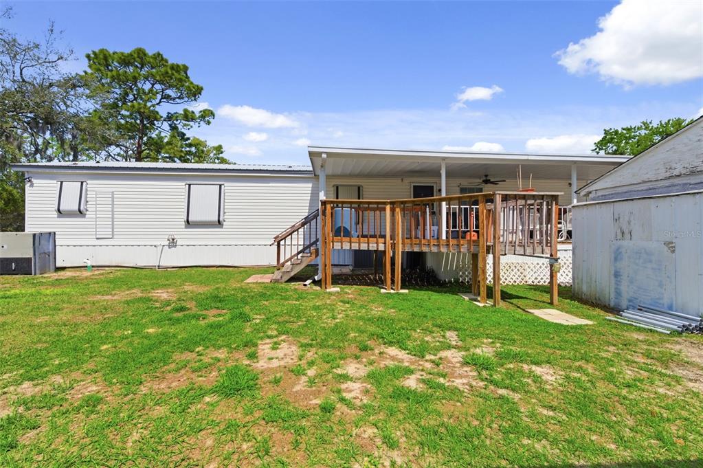 9634 Pat Street Hudson, FL 34669 - Photo 49 of 73 a view of a house with backyard and a tree