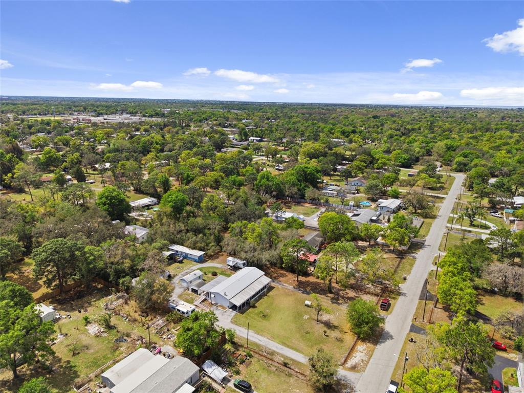 9634 Pat Street Hudson, FL 34669 - Photo 67 of 73 an aerial view of residential houses with outdoor and green space