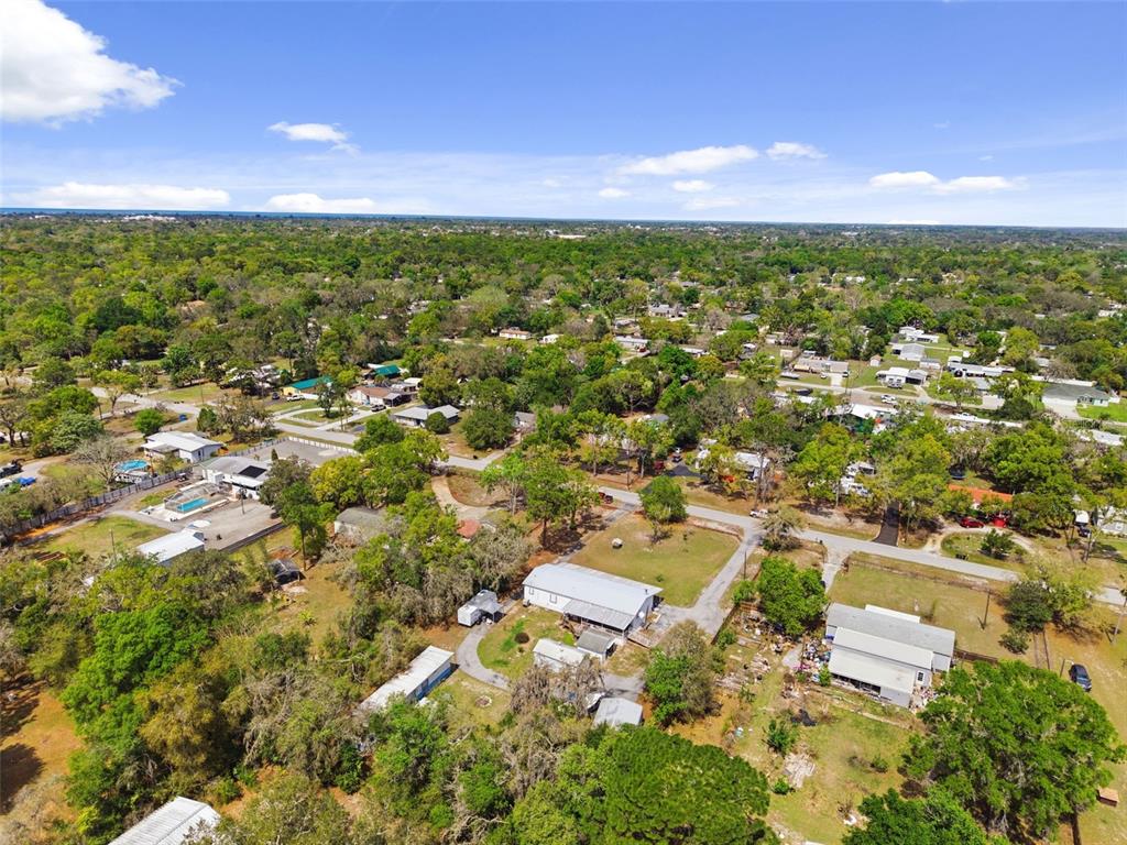 9634 Pat Street Hudson, FL 34669 - Photo 69 of 73 an aerial view of residential houses with outdoor space and trees