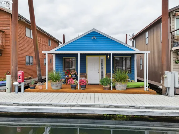 a front view of a house with porch and patio
