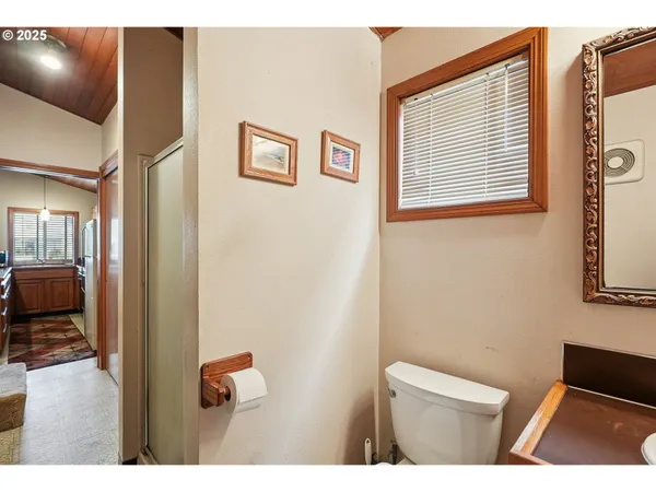 a bed room with a bed and a chair