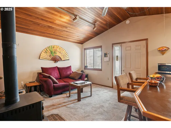 a living room with lots of furniture and a large window
