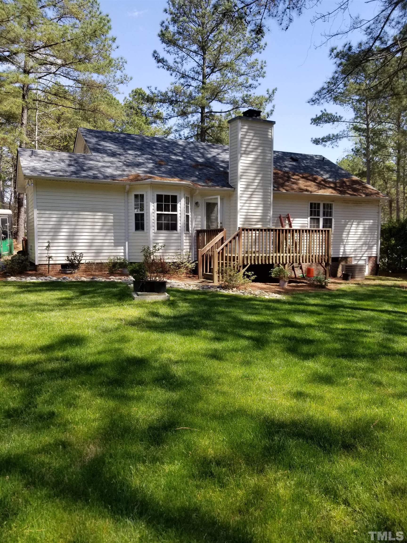 6408 Silver Spring Court Willow Spring, NC 27592 - Photo 2 of 11 a view of a big yard of front a house