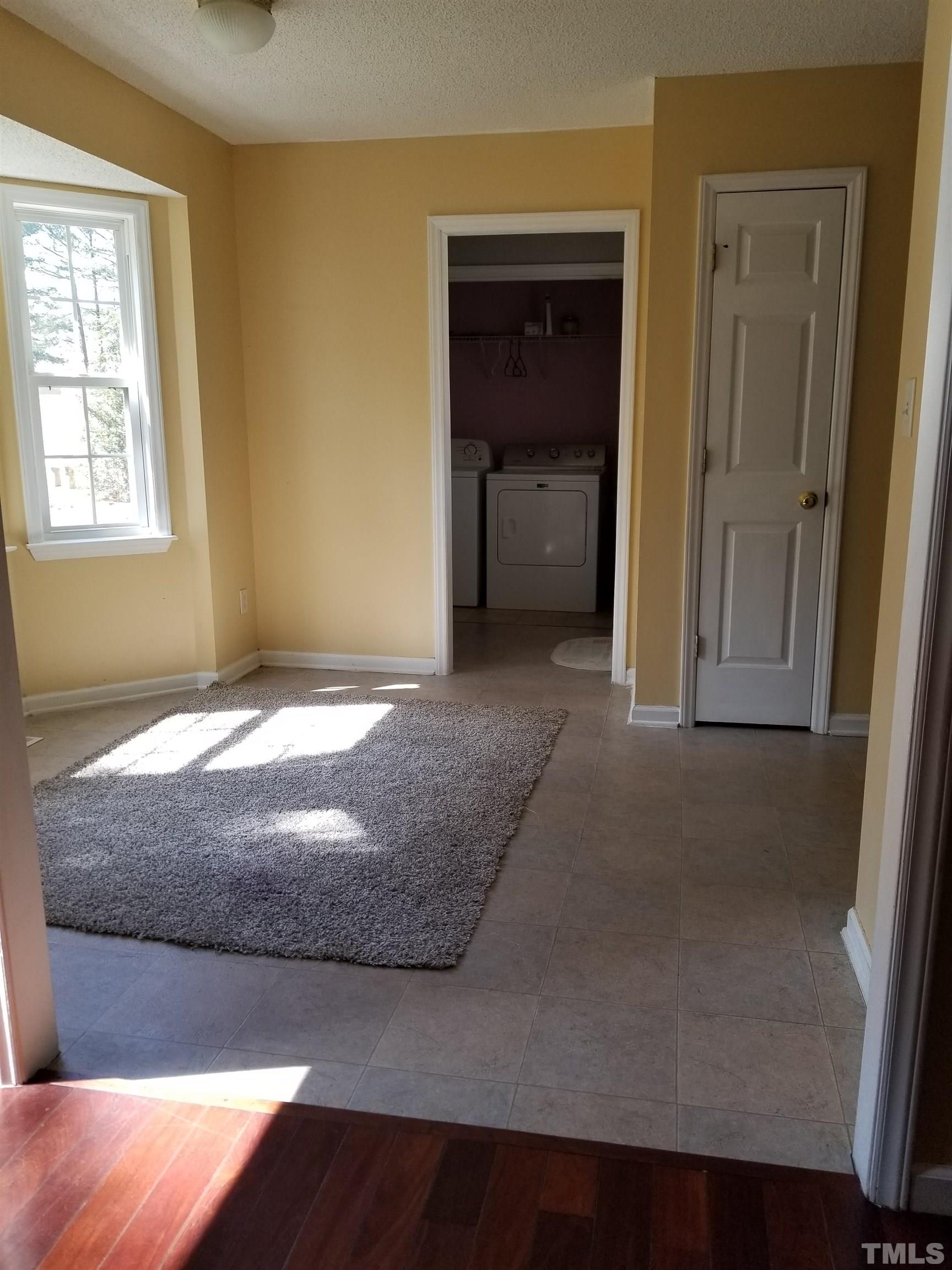 6408 Silver Spring Court Willow Spring, NC 27592 - Photo 3 of 11 a bedroom with a bed and a window