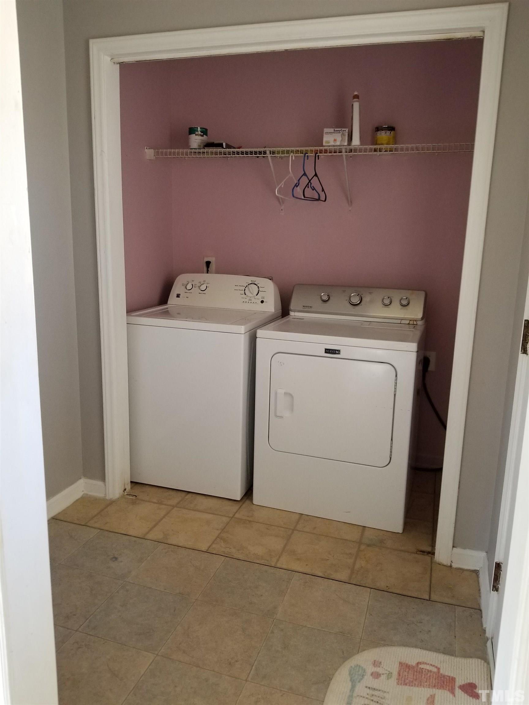 6408 Silver Spring Court Willow Spring, NC 27592 - Photo 5 of 11 a utility room with dryer and washer