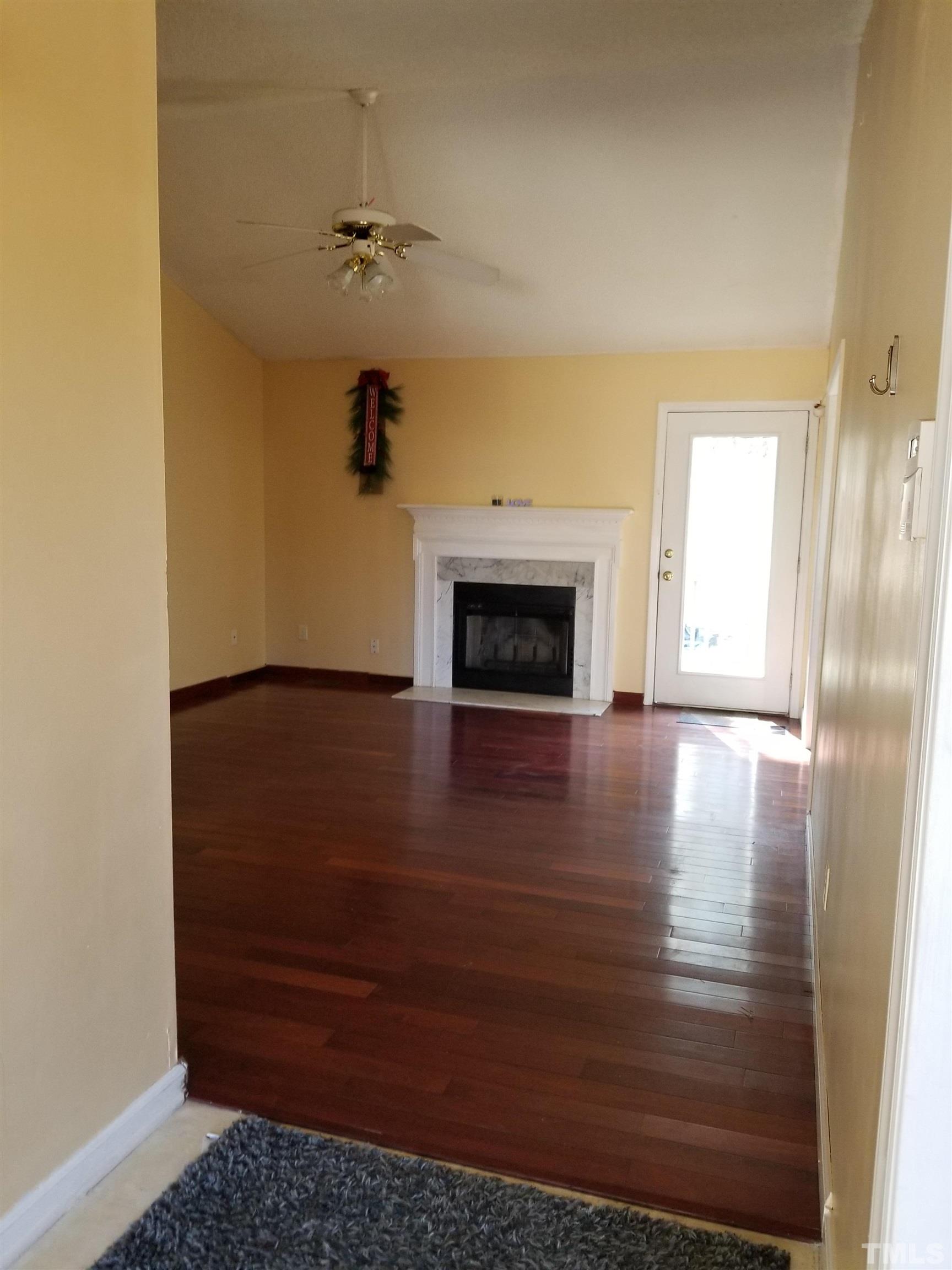 6408 Silver Spring Court Willow Spring, NC 27592 - Photo 6 of 11 a view of a livingroom with a fireplace