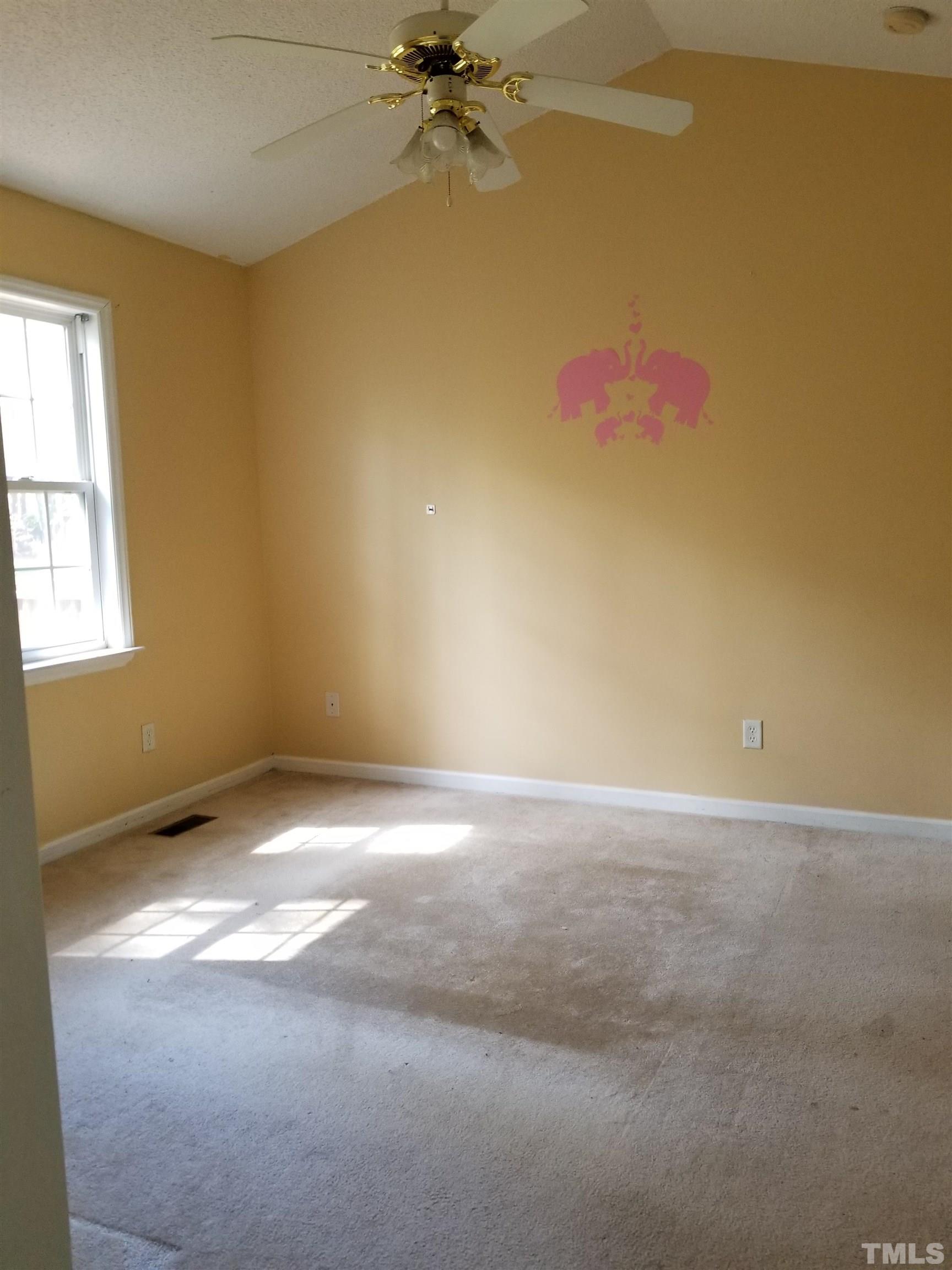 6408 Silver Spring Court Willow Spring, NC 27592 - Photo 7 of 11 en empty room with windows