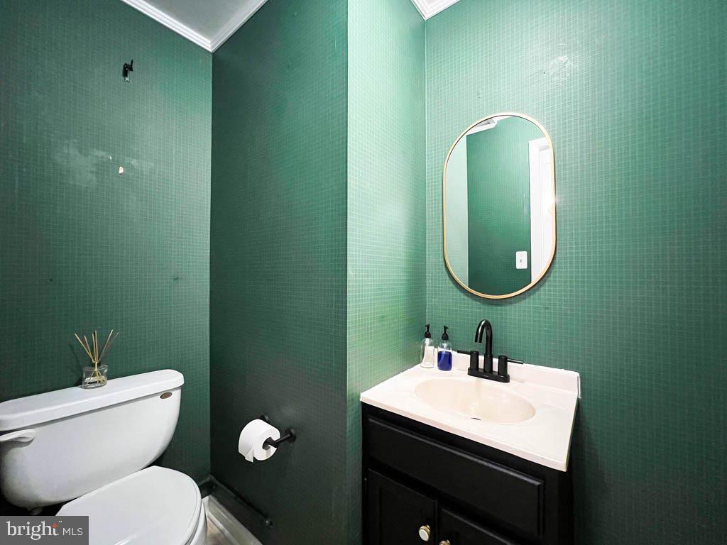 124 Deacon Road Fredericksburg, VA 22405 - Photo 14 of 48 a bathroom with a toilet sink and mirror