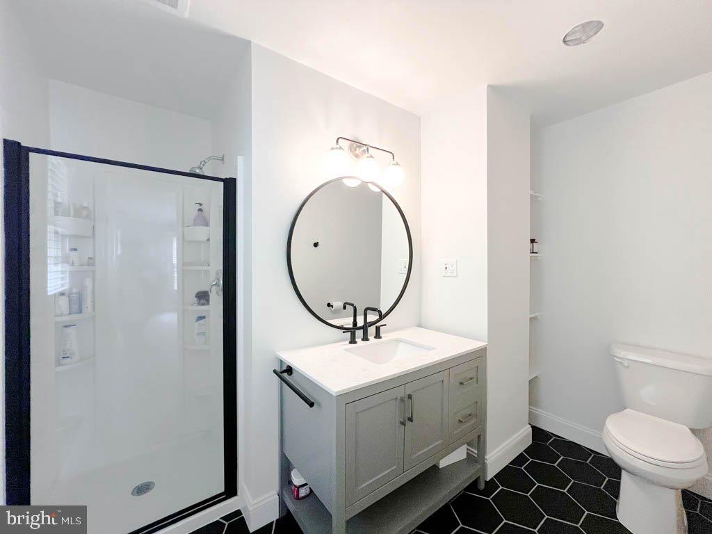 124 Deacon Road Fredericksburg, VA 22405 - Photo 15 of 48 a bathroom with a toilet a sink and a mirror