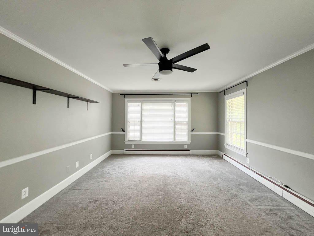 124 Deacon Road Fredericksburg, VA 22405 - Photo 17 of 48 a view of a livingroom with a ceiling fan and window