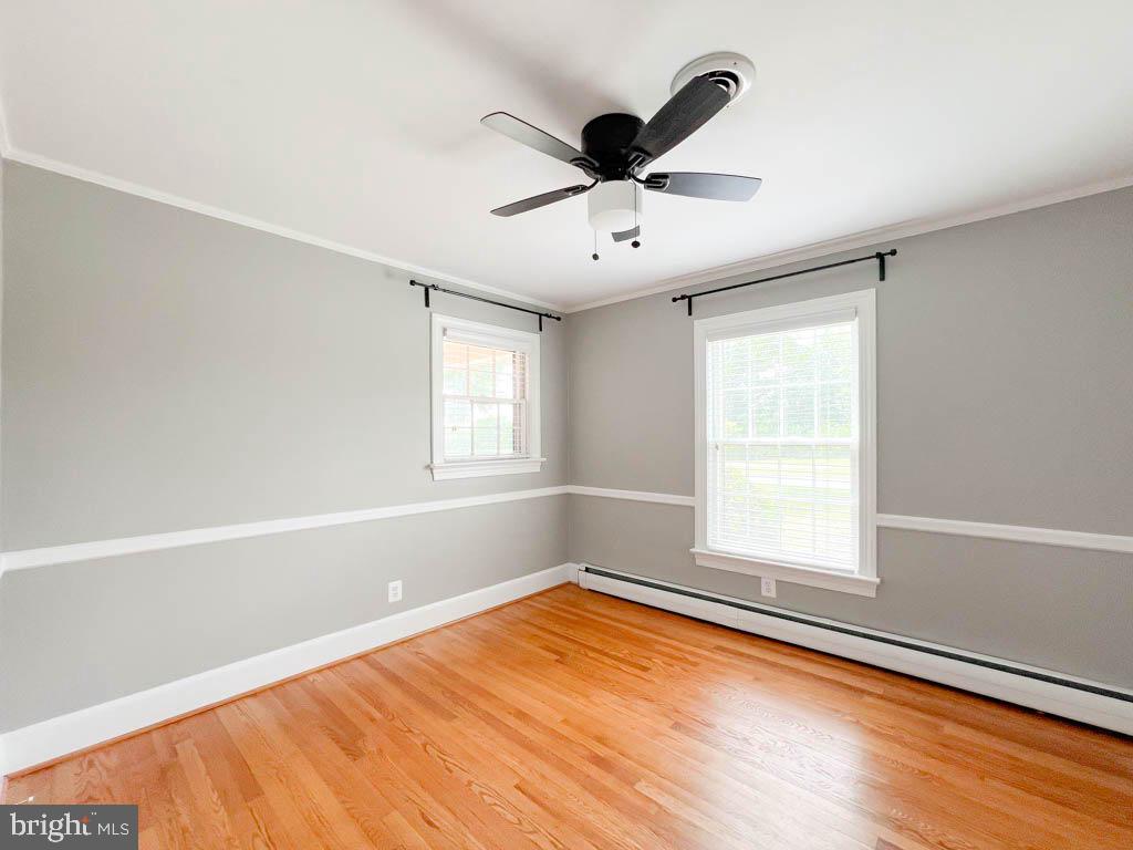 124 Deacon Road Fredericksburg, VA 22405 - Photo 20 of 48 a view of empty room with wooden floor and fan
