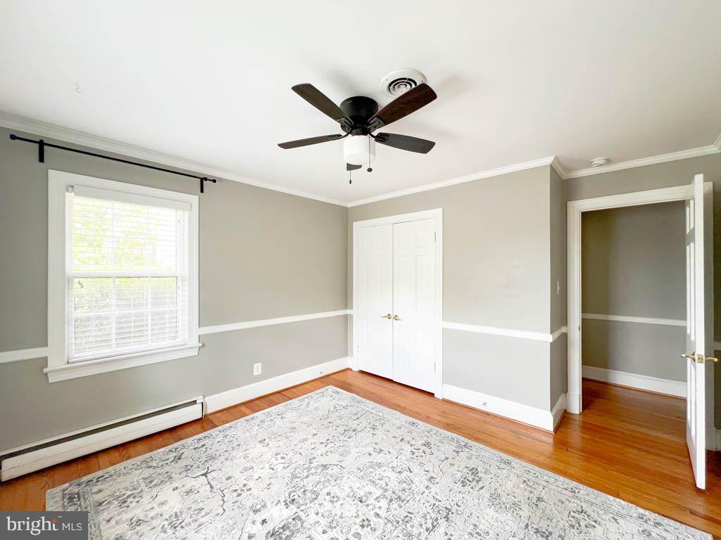 124 Deacon Road Fredericksburg, VA 22405 - Photo 23 of 48 a view of a livingroom with wooden floor and a ceiling fan