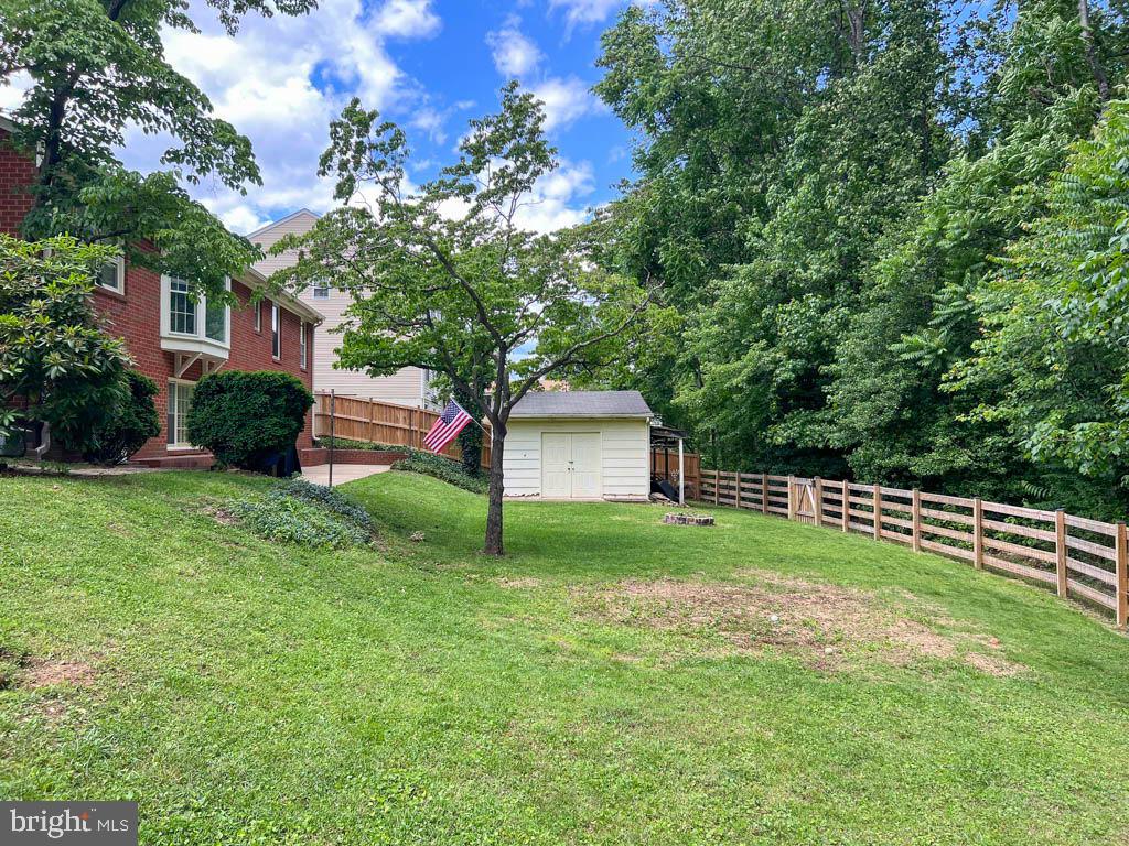 124 Deacon Road Fredericksburg, VA 22405 - Photo 33 of 48 a view of a backyard with large trees and plants