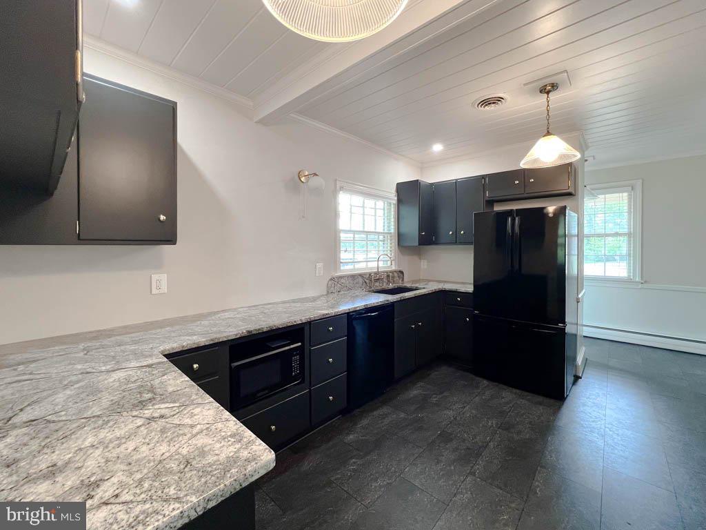 124 Deacon Road Fredericksburg, VA 22405 - Photo 4 of 48 a kitchen with granite countertop stainless steel appliances and wooden cabinets