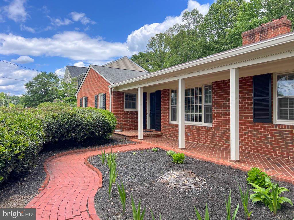 124 Deacon Road Fredericksburg, VA 22405 - Photo 44 of 48 a front view of a house with garden