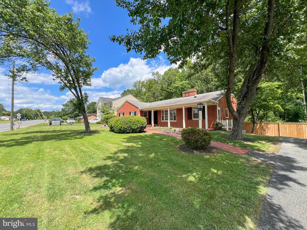 124 Deacon Road Fredericksburg, VA 22405 - Photo 47 of 48 a front view of a house with yard porch and green space