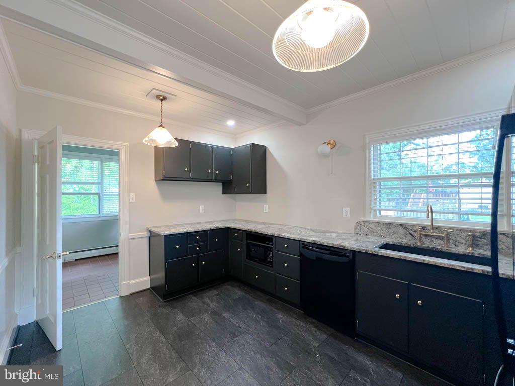 124 Deacon Road Fredericksburg, VA 22405 - Photo 5 of 48 a kitchen with granite countertop a sink and cabinets