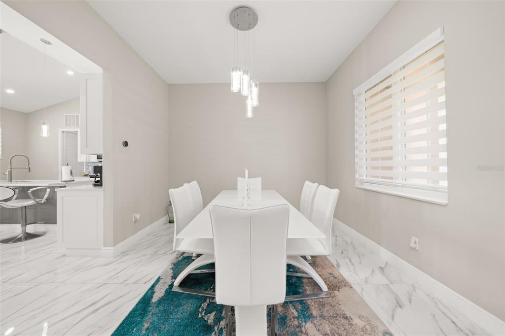 2009 Flower Terrace Sebring, FL 33875 - Photo 13 of 60 a very nice looking dining room with a large window table and chairs