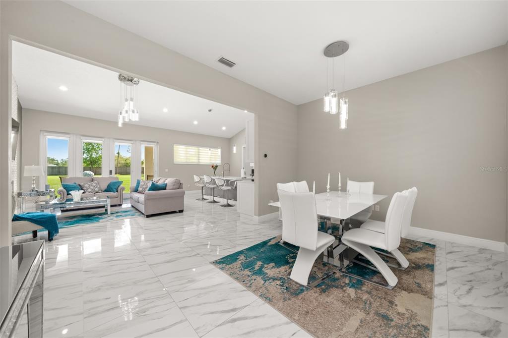 2009 Flower Terrace Sebring, FL 33875 - Photo 16 of 60 a living room with furniture and view of kitchen
