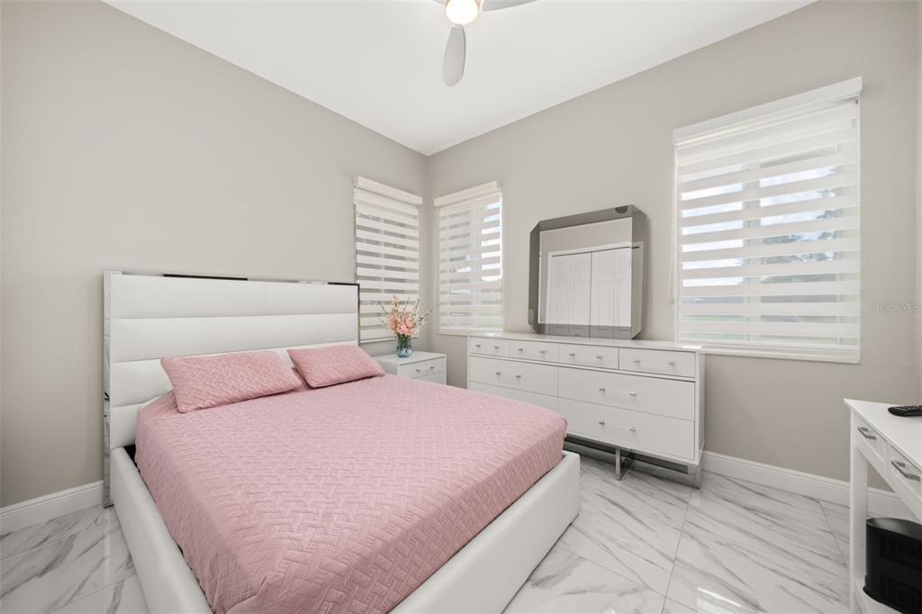 2009 Flower Terrace Sebring, FL 33875 - Photo 23 of 60 a bedroom with a bed and a window