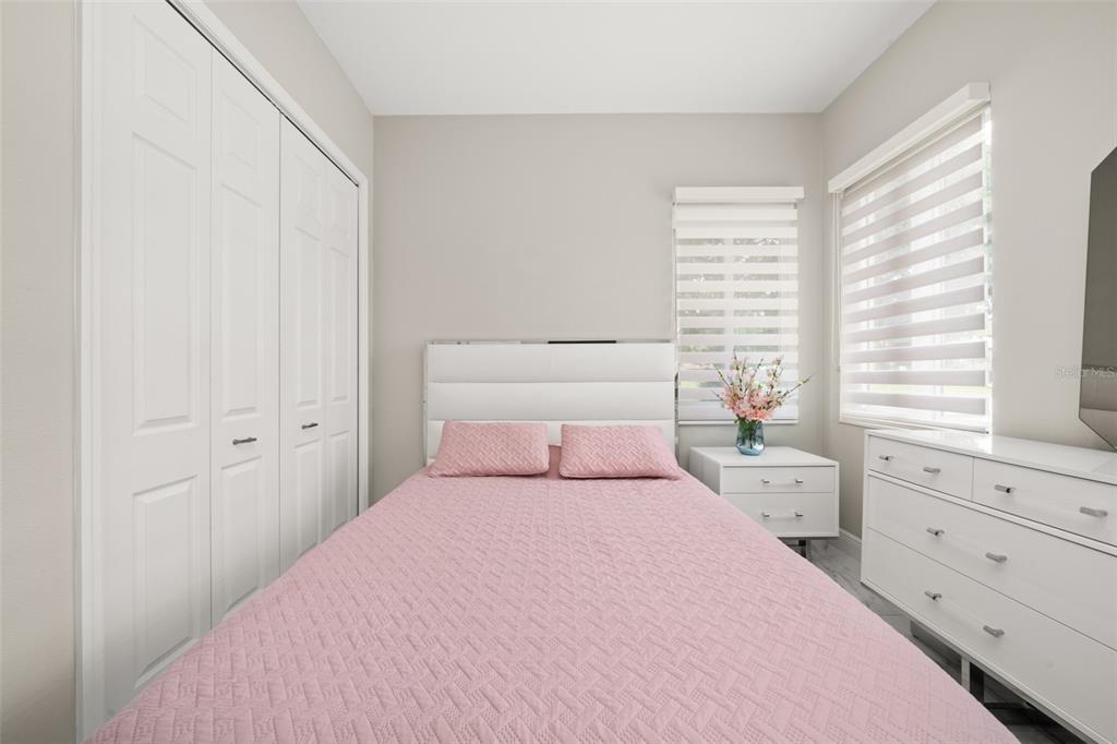 2009 Flower Terrace Sebring, FL 33875 - Photo 24 of 60 a bedroom with a large bed and a window