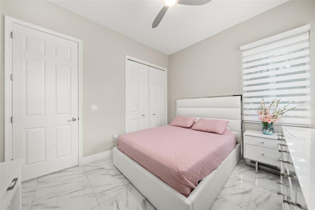 2009 Flower Terrace Sebring, FL 33875 - Photo 25 of 60 a bedroom with a bed and a window