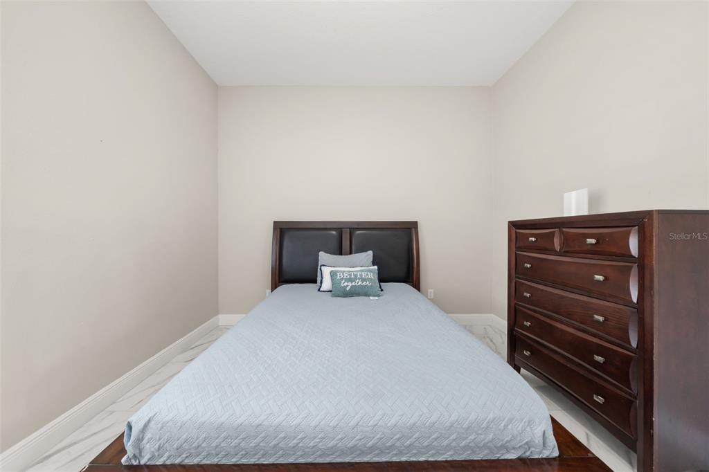 2009 Flower Terrace Sebring, FL 33875 - Photo 27 of 60 a bedroom with a bed and dresser