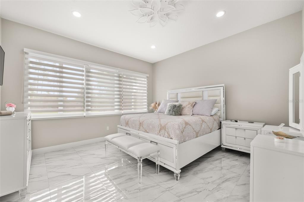 2009 Flower Terrace Sebring, FL 33875 - Photo 29 of 60 a spacious bedroom with a bed and a window