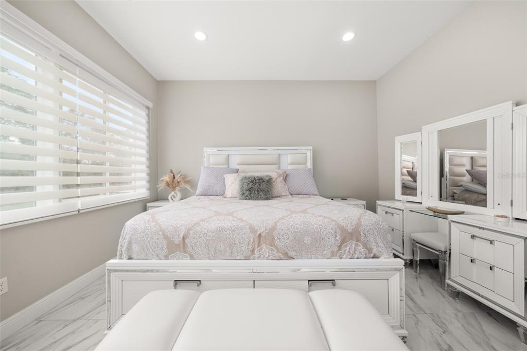 2009 Flower Terrace Sebring, FL 33875 - Photo 31 of 60 a bedroom with a large bed and a large window