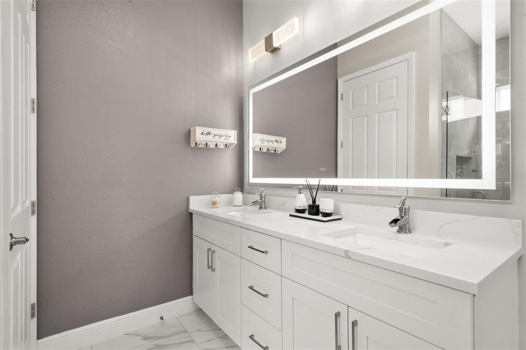 2009 Flower Terrace Sebring, FL 33875 - Photo 35 of 60 a bathroom with a sink and a mirror