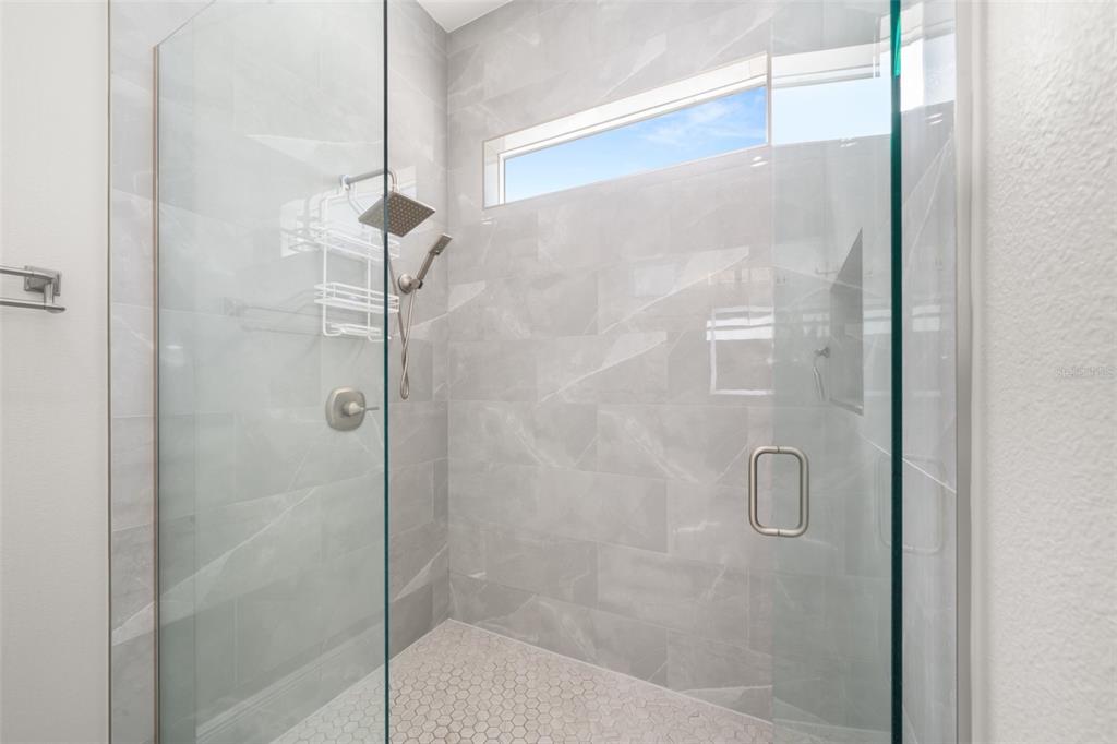 2009 Flower Terrace Sebring, FL 33875 - Photo 37 of 60 a bathroom with a glass shower door