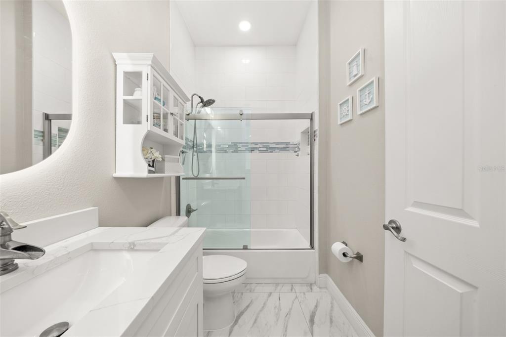 2009 Flower Terrace Sebring, FL 33875 - Photo 40 of 60 a bathroom with a sink a toilet and shower