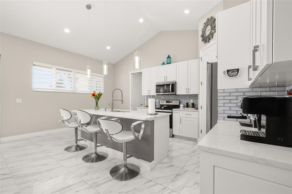 2009 Flower Terrace Sebring, FL 33875 - Photo 10 of 60 a kitchen with a sink cabinets and wooden floor