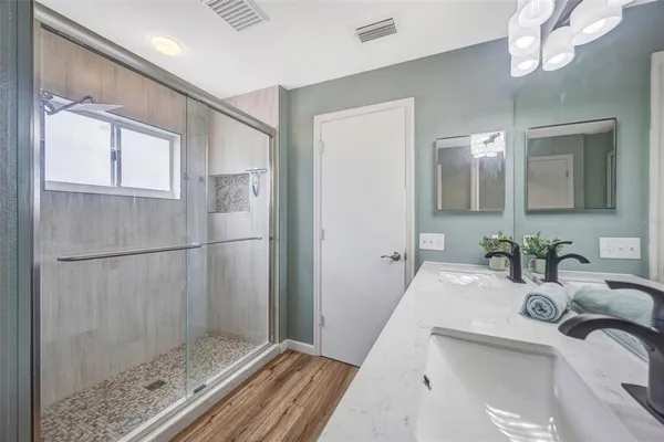 a bathroom with a sink and a mirror