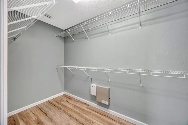 a view of a room with racks on the wall